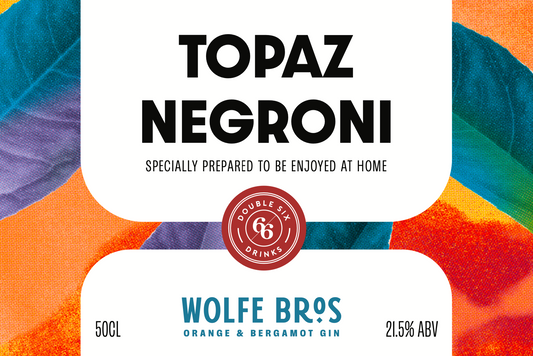 Topaz Negroni bottled cocktail by Wolfe Bros. Made with Orange & Bergamot Gin, Campari, and Yorkshire rhubarb.