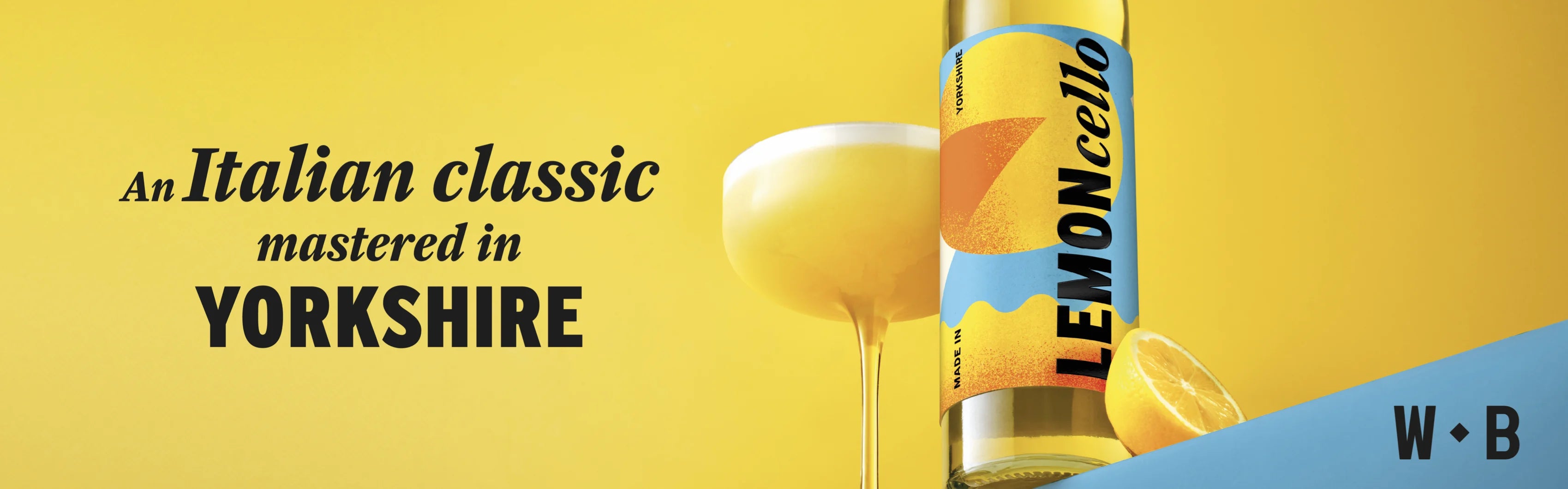 Wolfe Bros Lemoncello bottle with a chilled serve against a yellow campaign backdrop